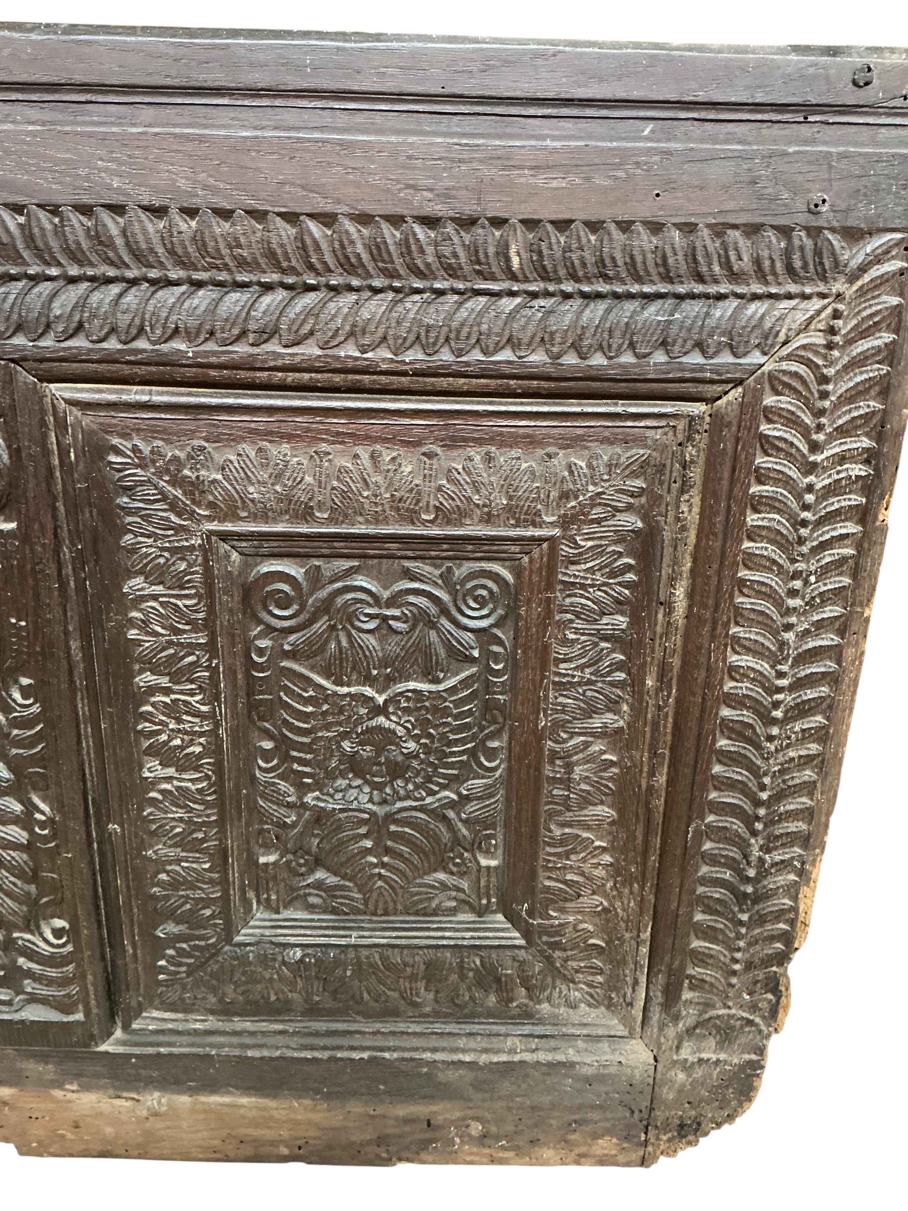 A 17th century carved oak panel, width 126cm, height 86cm